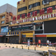 An African restaurant is closed off along with other businesses in Guangzhou where a neighborhood is in lockdown after several people tested positive for the novel coronavirus disease April 13, 2020.